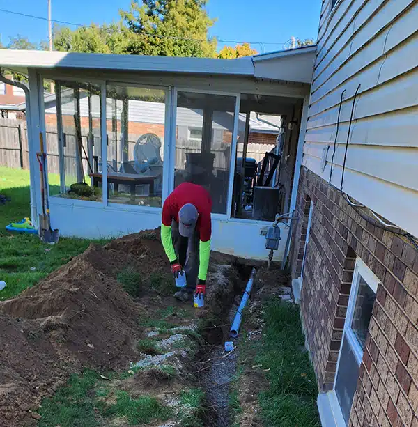 Spartan plumber working on trench sewer line in Dayton, OH.
